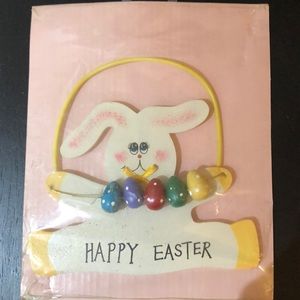 Hanging bunny with sliding eggs